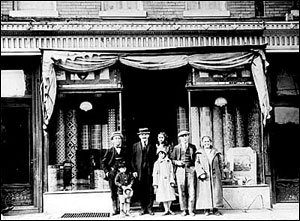 Alex and Ruchel Wernick on right; hardware store at 1707 St. Johns Place, 1921